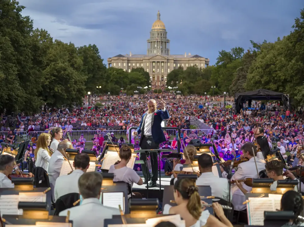 Orchestra playing in front of crowd