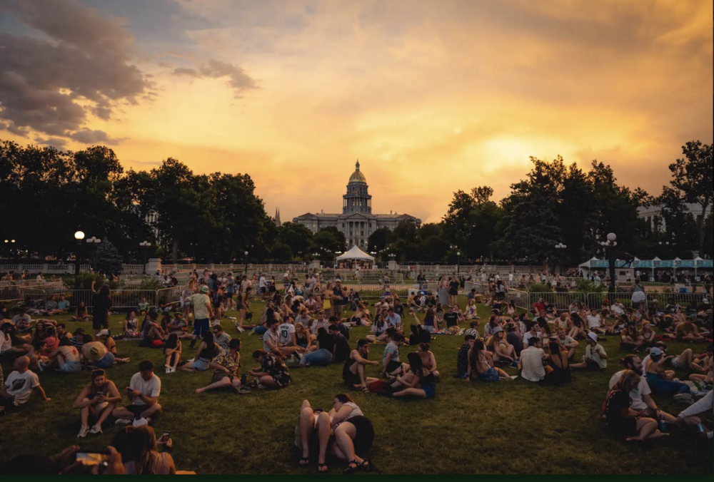 People sitting on grass in park