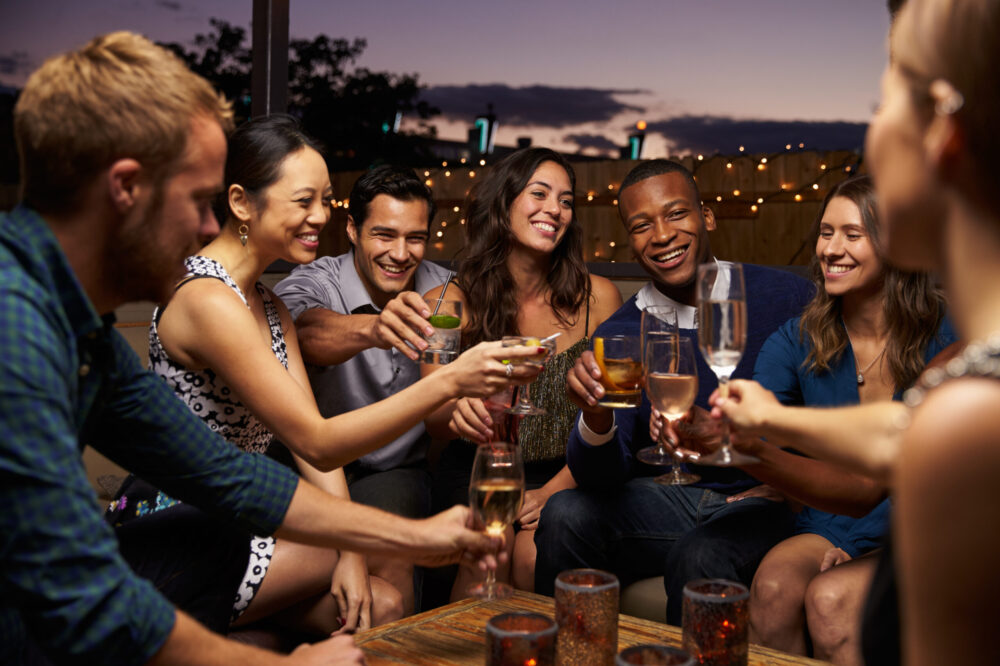 People smiling having a drink