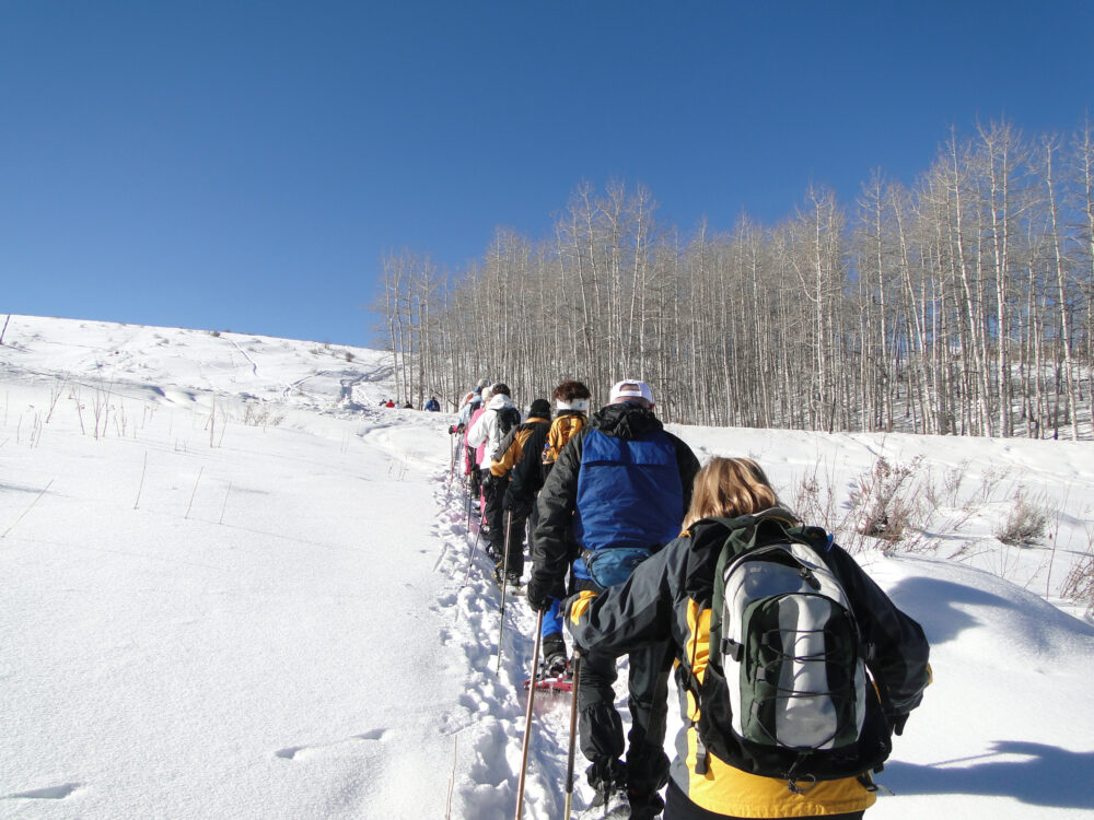 Group of people hiking in snow