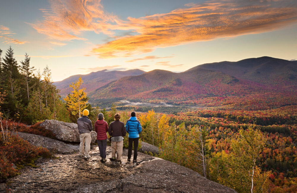 People overlooking mountains