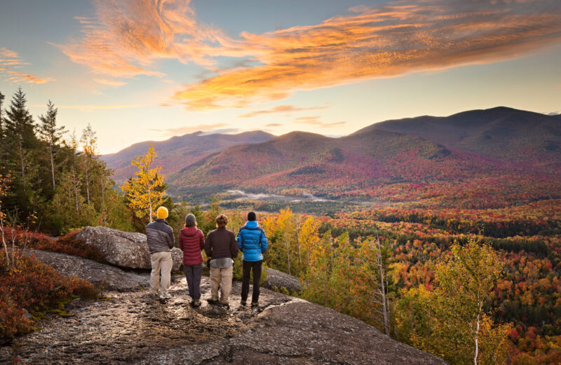 People overlooking mountains