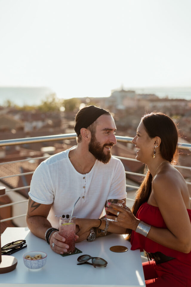 Two people smiling at each other on deck